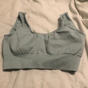 light blue, never worn, small sports bra